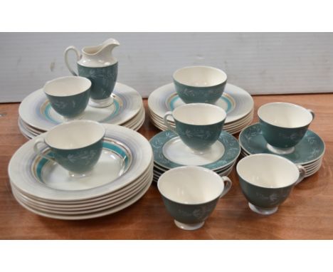 A part Royal Doulton 'Cascade' tea service and a Clarice Cliff part dinner service of simple Art Deco form with aqua decorati