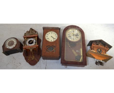 Three wall clocks to include an early 20th century oak cased example, a cuckoo clock and a mid 20th century Smiths Enfield oa