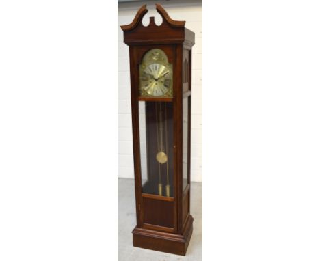 A modern mahogany longcase clock with broken swan neck pediment, gilded dial set with Roman numerals, height 192cms.