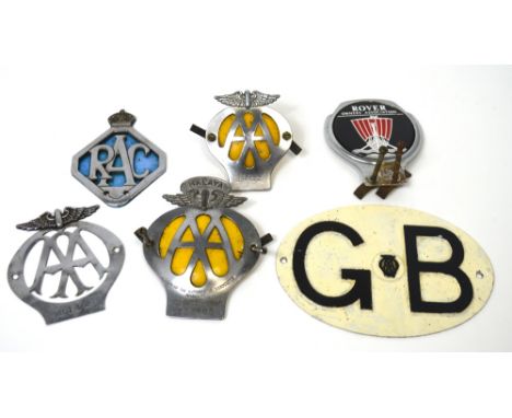 A automobile collector's lot comprising car badges to include AA and RAC.