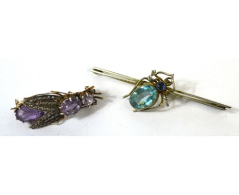 A silver gilt bar brooch with a central spider set with blue stones and a white metal fly brooch set with amethyst coloured s