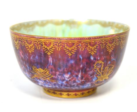 A Wedgwood butterfly ruby ground lustre bowl in the Boston Cup shape, made between 1914 and 1929, designed by Daisy Makeig Jo