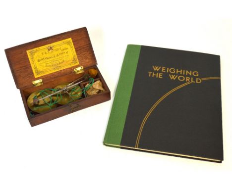 A boxed set of early 19th century W & T Avery of Birmingham scales and a related book entitled 'Weighing the World' which was
