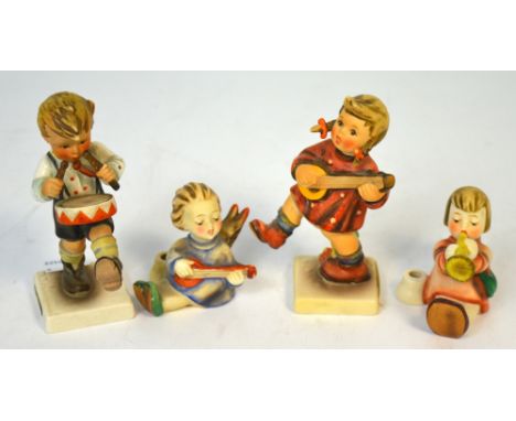 Four Hummel figures of children playing various musical instruments to include guitar, trumpet, banjo and drums (4). CONDITIO