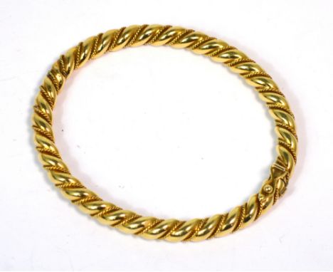 A 9ct gold hinged bangle with rope twist design, approx 19g.