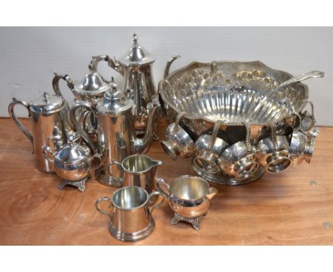 A quantity of plated ware to include a punch bowl with cups, a Walker and Hall tea service and one other plated tea service.