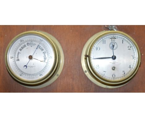 A Simpson Lawrence and Co. Glasgow ship's clock and a brass barometer, both mounted on a board (2).