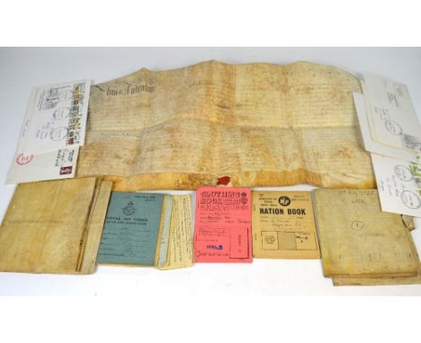 A quantity of ephemera to include indenture papers dating from 1659, ration books from WWII, an RAF service and release book 