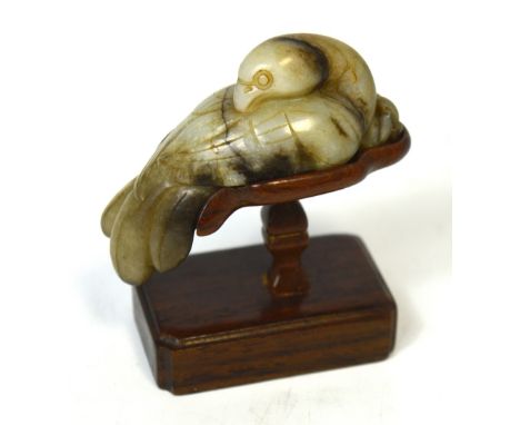 A Chinese carved celadon and included jade model of a dove on shaped rosewood stand, height including stand 6.5cm. *Provenanc