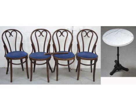 A small round marble top garden table on a metal base and nine various oak chairs to include bentwood examples and stick back