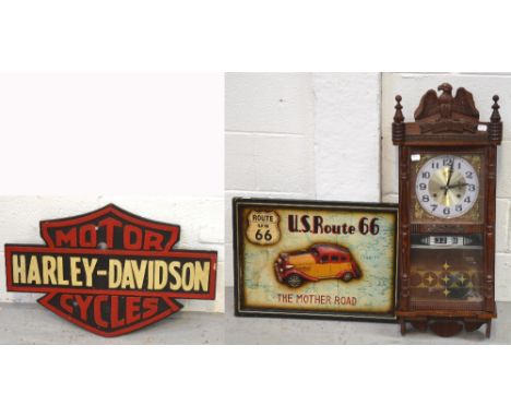 A reproduction thirty one day wall clock mounted with eagle to the top and a US Route 66 'The Mother Road' advertising board,
