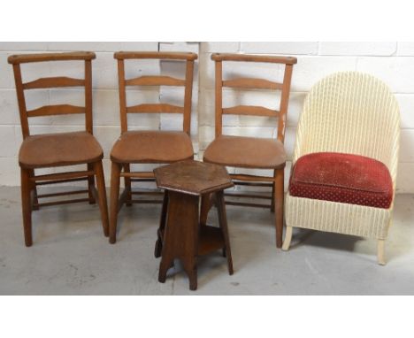 A set of three mid 20th century ladder back pine chairs, a Lloyd loom style wicker tub chair and a small oak side table with 