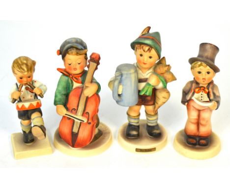 Four Hummel figures of boys, one playing a cello, one playing the drums, one singing and one carrying turnips (4). CONDITION 