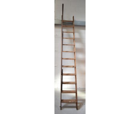A vintage Slingsby sliding stairway ladder.