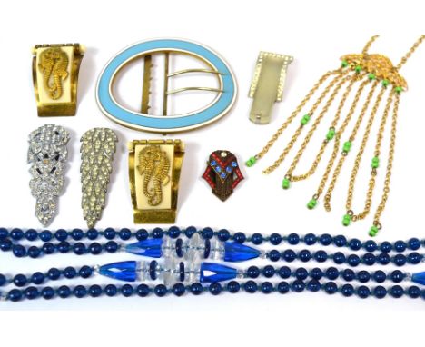 A quantity of costume jewellery, glass beads, dress clips and an enamel buckle.