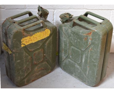 A pair of army green gas/oil canisters (2).