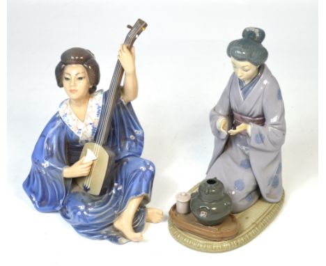 A Lladró figure of a kneeling geisha girl holding a tea bowl, height 22cm and a Danish geisha playing a musical instrument, h