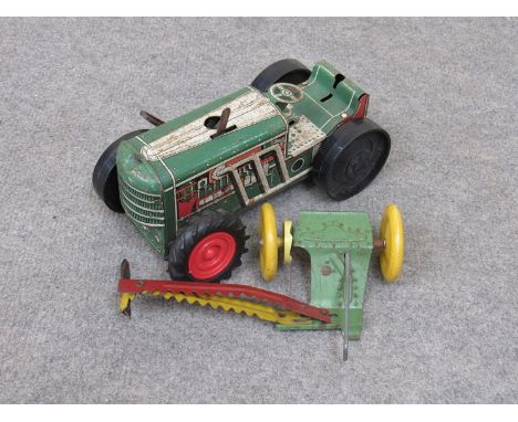 A mid 20th Century tinplate toy tractor and cutter by MARX a/f 