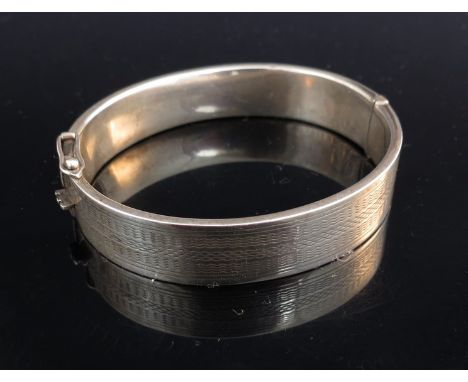 A white metal bangle marked silver, 16g