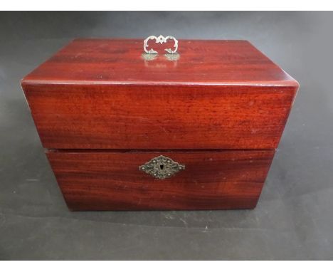A mahogany tea caddy
