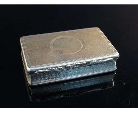 A William IV silver snuff box, rectangular engine turned body, applied shell and leaf thumb piece, vacant cartouche, London 1