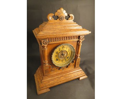 A late 19th Century American oak cased "Ansonia Clock Co" "Sharon" eight day striking mantel clock 