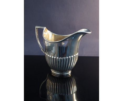 A William Hutton and Sons Ltd, silver milk jug, half fluted body, London 1912, 115g