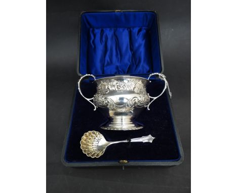 An Edwardian Barker Brothers silver twin handled sugar bowl and sifting spoon, Chester 1909 & 1908, 188g in presentation box 