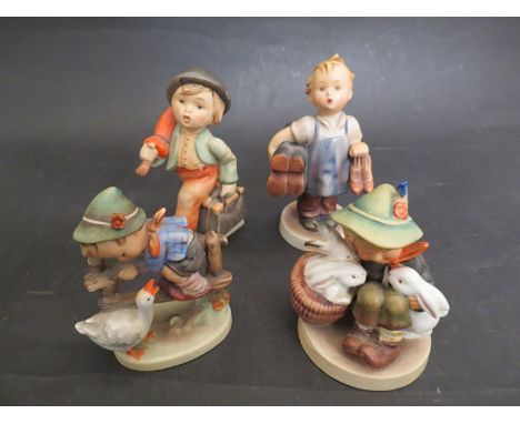 Four Goebel figures including boy with rabbits