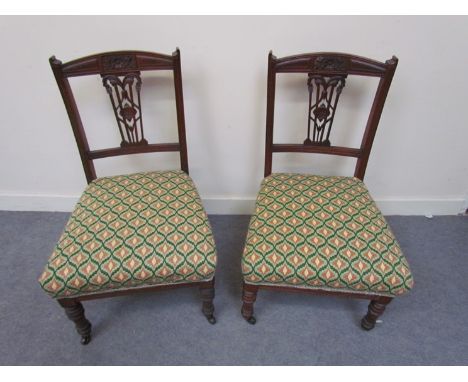 A pair of Victorian nursing chairs with colourful tapestry upholstery     