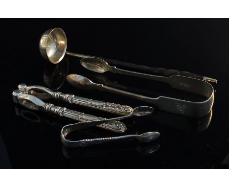 A Georgian silver toddy ladle, Victorian silver sugar tongs, embossed silver handled shell fish crackers and a pair of sugar 