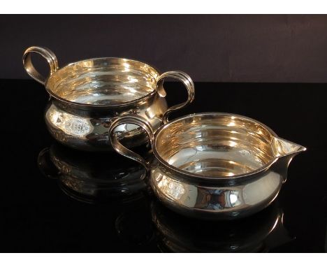 A Goldsmith & Silversmith company sugar bowl and cream jug, London 1910, 250g (slight dent)