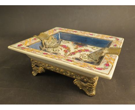 A late 20th Century cast brass mounted ceramic dish of rectangular form, printed and painted with swags of flowers within gil