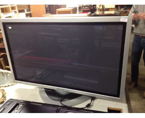 A PANASONIC TH-42PW6 42" TV WITH WALL MOUNTING BRACKET. T