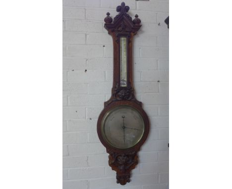 A Victorian oak Gothic style mercury barometer carved - Height 112cm