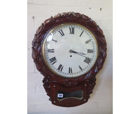 An 8 day 12 inch dial drop dial wall clock with carved decoration and fusee movement - in restored condition