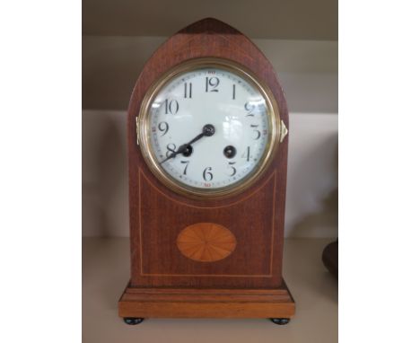 A mahogany cased 8 day mantle clock with inlay, strikes hours and half on gong, Arabic numerals to white enamel dial - workin