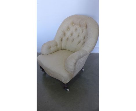 A Victorian button back armchair recently re upholstered