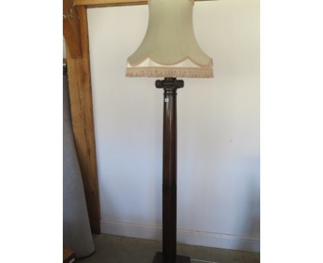 A very striking oak standard lamp in the form of a Corinthian column, circa 1920 with later shade
