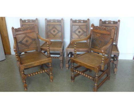 A set of six 18th century style oak dining chairs on bobbin supports including two carvers