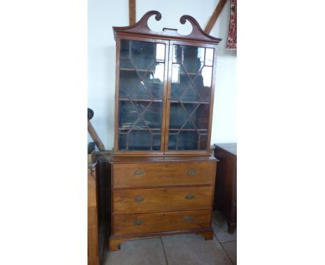 A late Georgian mahogany secretaire bookcase, the base with three drawers the top fitted as a secretaire standing on bracket 