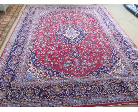 A red ground find handmade Persian Keshan carpet - 3.95m x 3.05m 