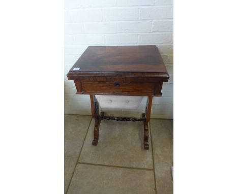 A Victorian rosewood fold over card games table/work table on twin end supports - Height 75cm x Width 51cm