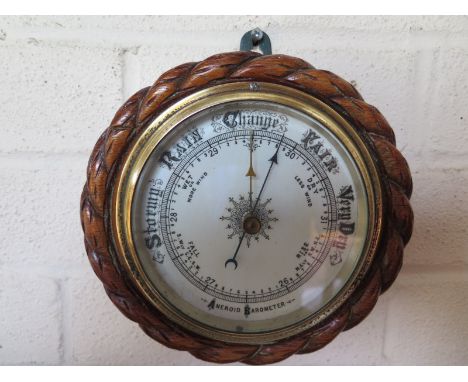 An oak rope twist aneroid barometer