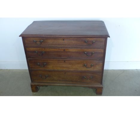 A Georgian mahogany chest with four long graduating drawers on shaped bracket feet - Height 83cm x 94cm x 48cm - in need of s