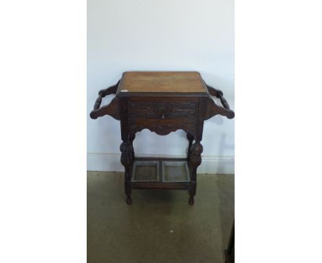 A carved and stained oak umbrella/stick stand - 74cm x 32.5cm x 77cm high