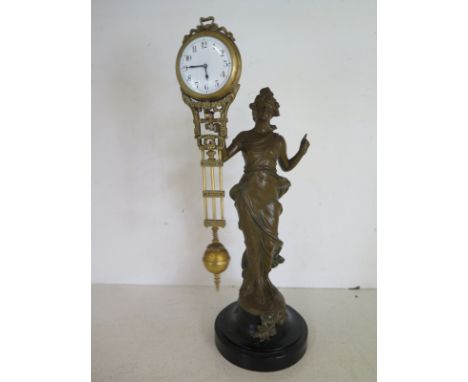 An early 20th century Diane mystery arm clock - Arabic numerals to dial - Height 35cm