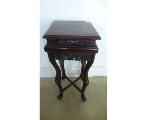 A small carved jardiniere stand - Height 61cm x 24cm x 24cm