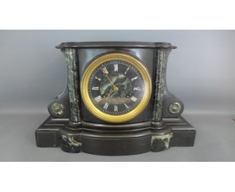 A Belgian slate and marble mantle clock, Roman numerals to black dial