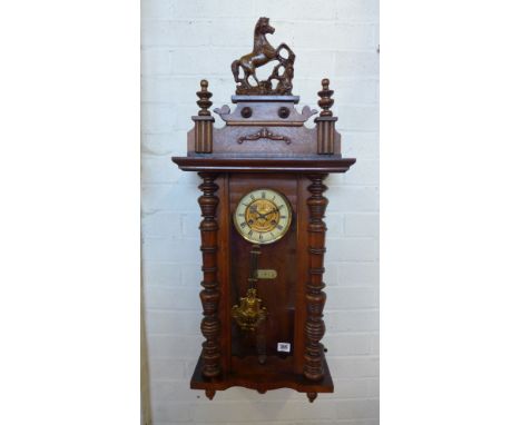 A spring driven walnut Vienna style wall clock - in working order - Height 97cm